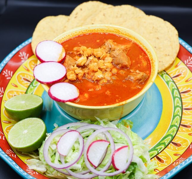 Pork, hominy and red broth, served with radish, tortillas and lime at Super Carniceria.